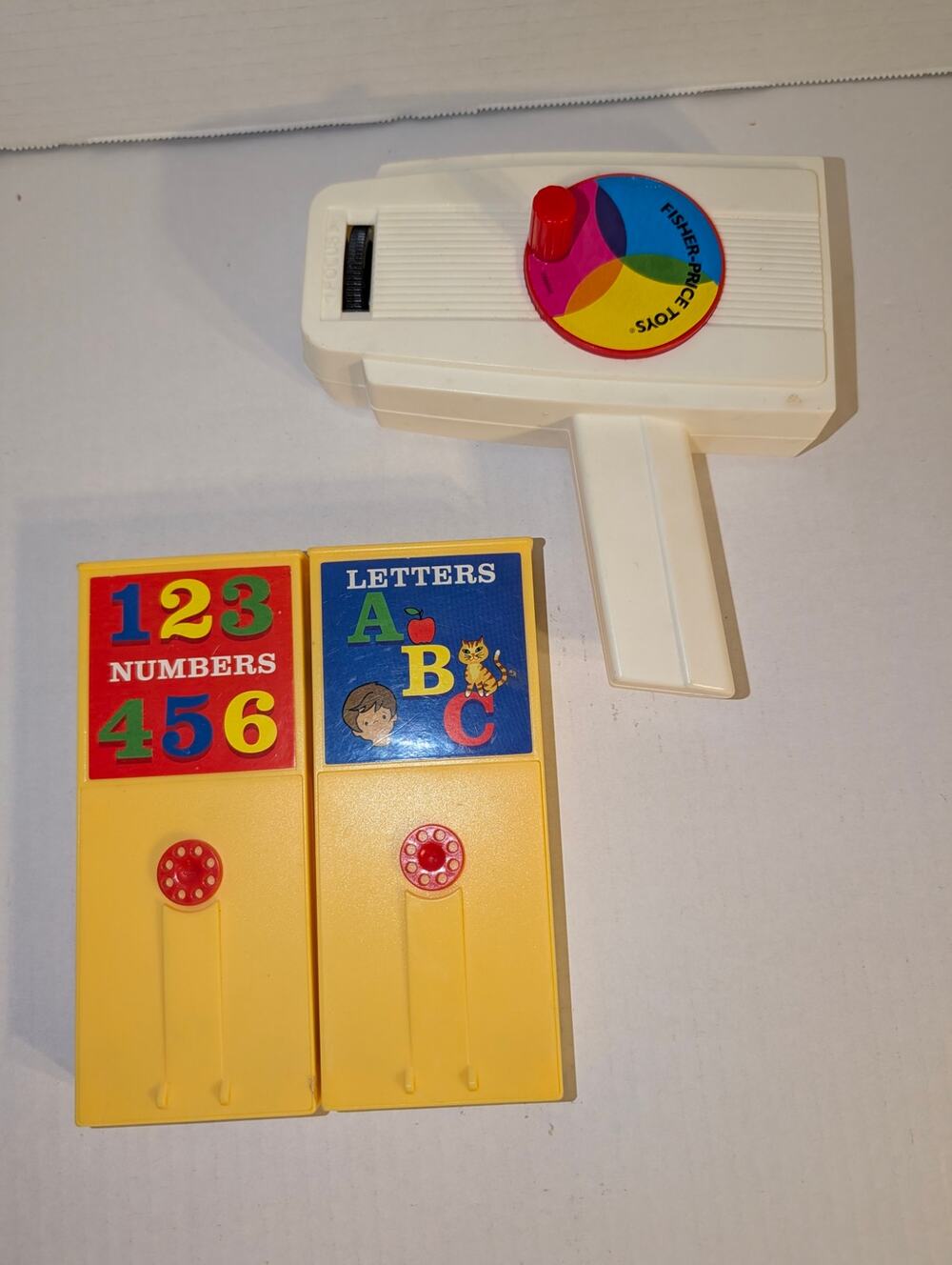 Vintage 1970's Fisher Price Movie Viewer 2 Cartridges Numbers Letters Works